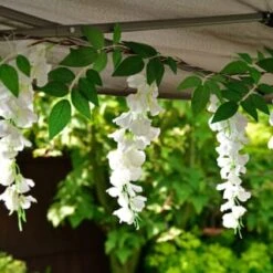 Solar Powered 180cm Artificial Leaf Garland With Wisteria Flowers - Warm White 9 Solar Powered 180cm Artificial Leaf Garland With Wisteria Flowers - Warm White -Garden Furniture 379258 180cm solar powered artificial leaf garland with wisteria flowers 20 warm white micro leds